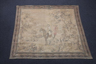 A machine made tapestry wall hanging depicting mounted figures in a wooded area 182cm x 213cm 