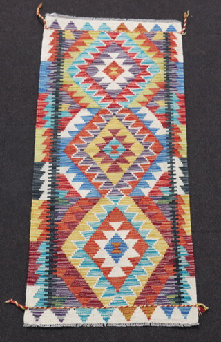 A yellow turquoise and brown ground Chobi Kilim runner 147cm x 66cm 