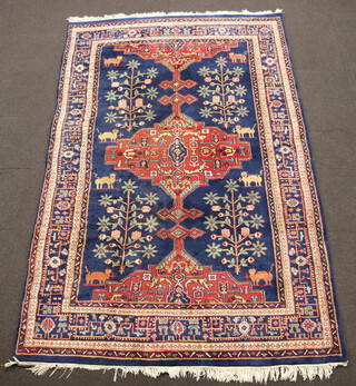 A blue and floral ground Persian rug with central medallion, having an animal motif within a multi row border 308cm x 201cm 