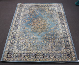 A blue and gold ground floral patterned Persian style machine made rug with central medallion 360cm x 277cm 