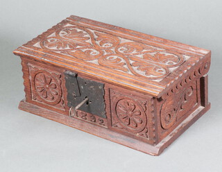 A Victorian rectangular carved oak trinket box in the form of a coffer with iron lock, the front dated 1892 10cm h x 28cm w x 16cm d (with key but locked)