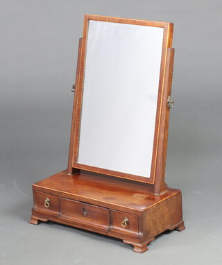 A 19th Century rectangular plate dressing table mirror contained in an inlaid mahogany swing frame, the base fitted 3 drawers, raised on ogee bracket feet 54cm h x 38cm w x 20cm d 