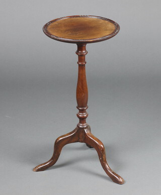 A Georgian style circular mahogany wine table raised on pillar and tripod supports 60cm h x 28cm diam. 