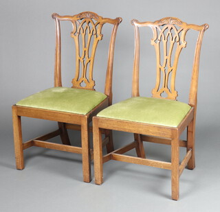 A pair of Chippendale style dining chairs with pierced vase shaped slat backs and upholstered drop in seats on square tapered supports, H framed stretcher 95cm h x 54cm w x 45cm d 