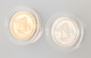 A Royal Mint 22ct yellow gold Forth Rail Bridge commemorative coin 19.6 grams together with a silver ditto 9.5 grams 