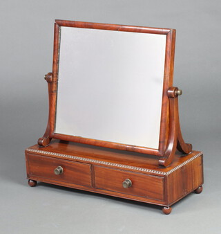 A William IV rectangular plate dressing table mirror contained in a mahogany swing frame, base fitted 2 drawers, raised on bun supports 54cm h x 54cm w x 22cm d 