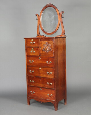 An Edwardian mahogany dressing chest, the top with oval plate mirror above 2 short drawers flanked by a cupboard enclosed by a panelled door above 4 drawers with brass swan neck drop handles, raised bracket feet 174cm h x 61cm w x 40cm d