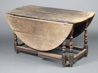 A 17th/18th Century bleached oak oval dropflap gateleg dining table on turned supports 71cm h x 61cm when closed x 163cm when open 