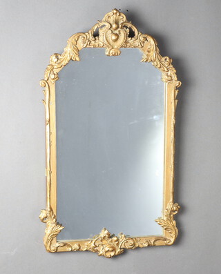 A rectangular plate mirror contained in a gilt plaster frame 63cm x 37cm 