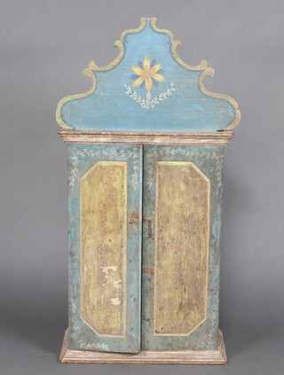 A 19th Century blue and gilt painted Continental shrine cabinet enclosed by panelled doors 107cm h x 56cm w x 26cm d, containing a plaster bust of a saint (f) 50cm h 