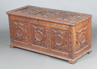 A Victorian heavily carved oak coffer with hinged lid 60cm h x 126cm w x 53cm d 