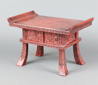 A Japanese red lacquered altar table fitted a drawer, raised on outswept supports 23cm h x 34cm w x 12cm d 