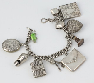 A silver charm bracelet with 2 stamp holders 55 grams