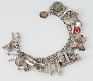 A silver charm bracelet 77 grams 