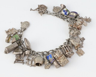 A silver charm bracelet 76 grams