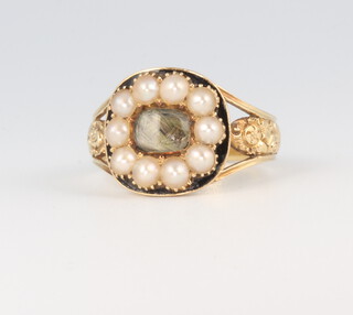 A George IV yellow metal seed pearl and enamel mourning ring, dated 1822, 5 grams, size O 
