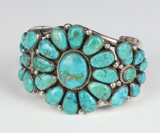 A sterling silver turquoise set South American bangle 7cm 