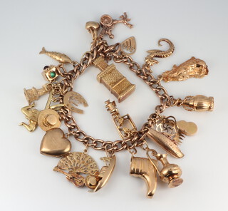 A 9ct yellow gold charm bracelet (some charms not marked), gross weight 53 grams