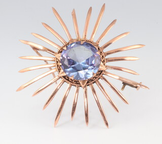 A mid-Century yellow metal amethyst star burst brooch 9 grams, 45mm 