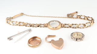 A lady's 9ct yellow gold watch and bracelet, a ditto heart shaped padlock and a bar brooch, gross weight including glass and pin 12 grams 