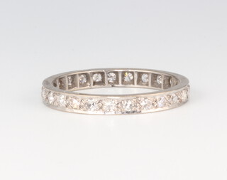 A white metal diamond eternity ring 2.7 grams, size R 