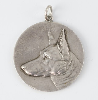 A silver medallion modelled with the face of an Alsatian Birmingham 1933, 24 grams