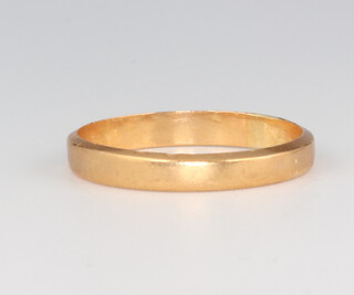 A Chinese yellow metal wedding band 2.3 grams size N 1/2 