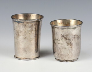 A Dutch silver beaker 7cm, a ditto 8cm, 171 grams 