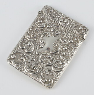 A repousse silver card case with scroll decoration Chester 1912, 10cm, 53 grams 