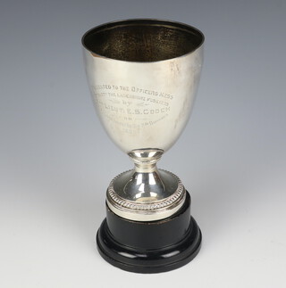 A Victorian silver trophy cup with presentation inscription, London 1899, 15.5cm, 319 grams on a wooden socle base 