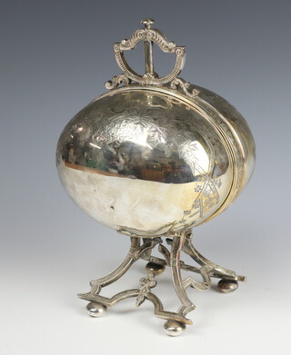 An Edwardian silver plated ovoid shaped muffin server with button automated action, raised on bun feet 28cm 