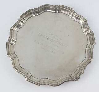 A silver salver with Chippendale rim and presentation inscription Birmingham 1938 21cm, 447 grams 