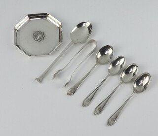 An octagonal silver nut dish London 1936, 5 spoons and a pair of sugar nips, 172 grams