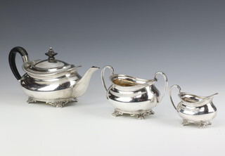 An Edwardian silver 3 piece tea set with ebony mounts and beaded decoration on scroll feet Sheffield 1905/06 and 07, gross weight 718 grams 