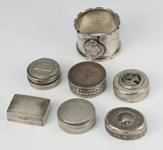 A Continental white metal coin set pill box, 5 others and a napkin ring, 173 grams