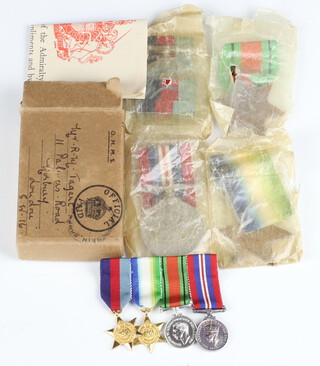 A group of Second World War medals to R M Tagart comprising 1939-45, Atlantic Star, Defence medal, War medal, together with dress miniatures in original posting box  