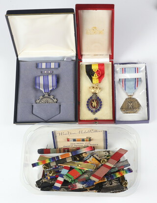 A small quantity of world medal ribbons and 3 medals 