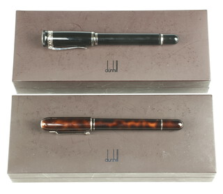 A Dunhill tortoiseshell effect fountain pen with 18ct nib, boxed, a ditto black fountain pen with 18ct nib, boxed 