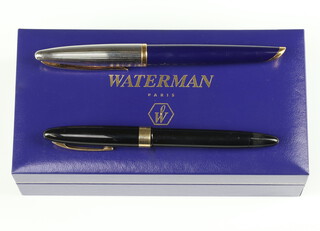 A Waterman blue and steel fountain pen with 18ct nib, boxed, a Sheaffer black ditto with 14ct nib (no box)