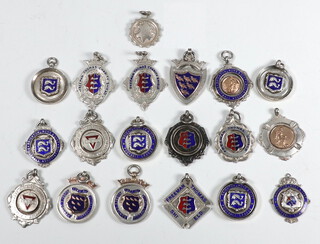 A collection of 1930's silver and enamelled sports fobs