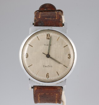 A gentleman's vintage Timex Electric steel cased wristwatch in a 33mm case on a leather strap with original box