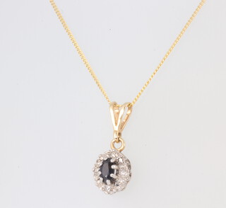 A yellow metal 9ct necklace with diamond and sapphire pendant 1.6grams, 44cm 