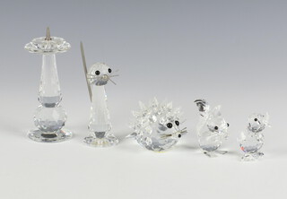 A Swarovski Crystal  hedgehog 4cm, squirrel 4cm, chick 3cm, sun dial 8cm and cat 7cm (a/f)