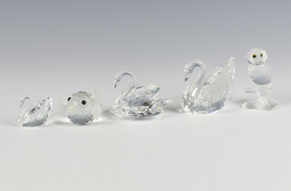 A Swarovski Crystal figure of a swan 5cm, ditto 4cm, another 3cm, a blow fish 5cm and an owl 5cm, all boxed 