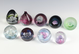 Nine Caithness paperweights - Gemini 8cm, Aquarelle no.493 of 500 7cm, Domino 372 of 1000 10cm, Blue Velvet 153 of 500 9cm, Moore Orchid 411 of 1000 9cm, Tranquility no.524 of 750 9cm, Jubilee 9cm no. 75 of 500, Reflections 7cm and 1 other 11cm, all boxed 