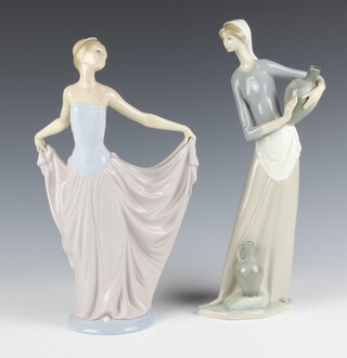 A Lladro figure of a lady 30cm, a ditto of a water carrier 31cm 