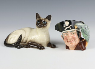 A Royal Doulton reclining Siamese cat 1559 17cm, ditto character jug Long John Silver 10cm 
