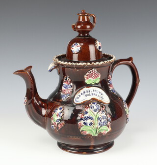 A Victorian Barge Ware teapot, the lid with teapot finial, the body with panels of flowers inscribed Mr & Mrs Brown Foleshill 30cm 