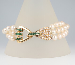 A fine yellow metal diamond princess cut emerald and cultured pearl 3 strand bracelet, the clasp set with 23 brilliant cut diamonds each approx. 0.02ct set with 18 princess cut emeralds each approx. 0.03ct, 21cm 33.8 grams, the pearls approx. 6mm diam. each 