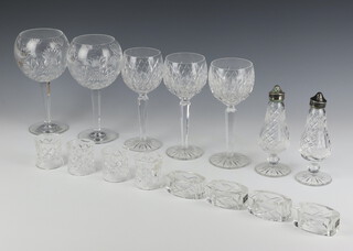 Three Waterford Crystal hock wine glasses, 2 large balloons, a pair of condiments, 4 circular napkin rings and 4 ovoid napkin rings 